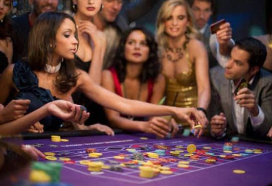Corporate casino night with guests at themed entertainment stations