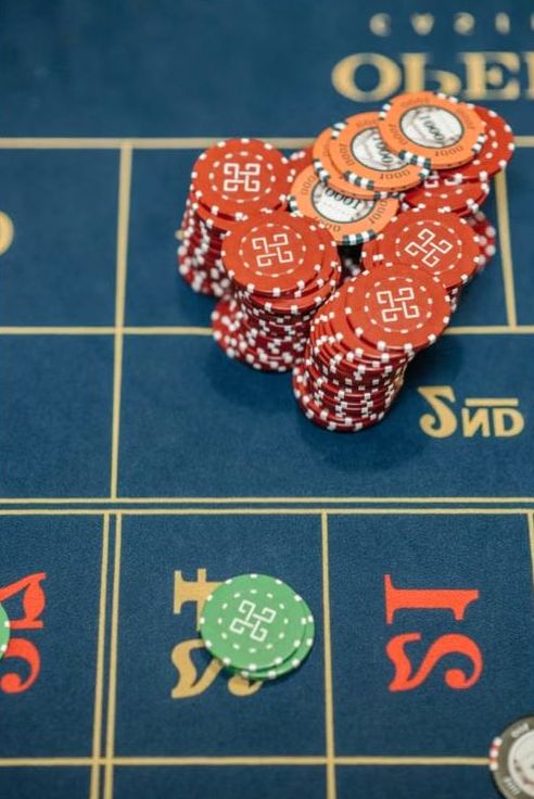 Full casino night venue setup with themed lighting and several stations